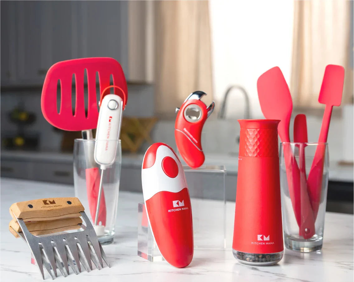 Kitchen Mama product lineup displayed on a countertop, featuring electric can openers, silicone utensils, gravity grinder, meat claws, and bottle opener, with Kitchen Mama logo.